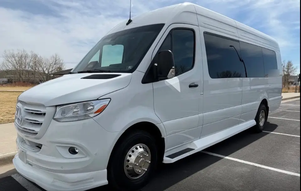 Timnath 16 passenger white Sprinter limo bus